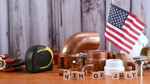 American flag with different copper water pipe and fittings plumber tools. Stock Footage 153449959