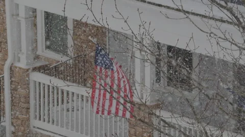 American Flag During Winter Storm Gianna. Strong Snow Blizzard in Winter, G.. Stock-Footage 328031556