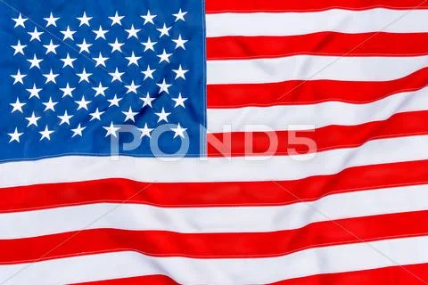 American flag fills the frame completely and fluttering in the wind Stock Photos