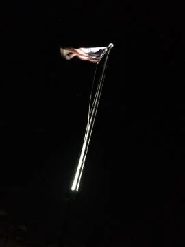 American flag on flagpole motion background black Stock Photos