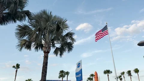 American flag on a flagpole waving in the wind. NASA Stock Footage 267521160