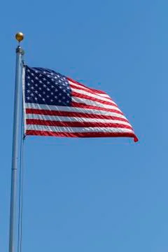 American Flag Flapping In The Wind On A Clear Day Stock Photos