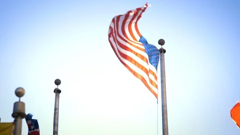 American flag flies majestically in high wind close up in slow motion Stock Footage 104168064