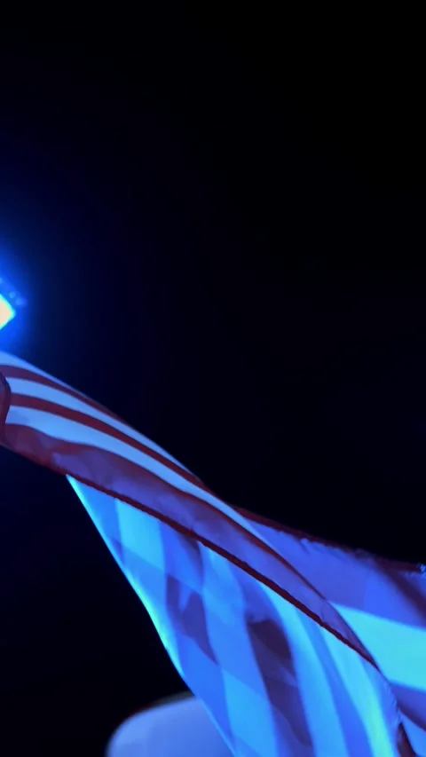 American flag flutter in the wind at night. USA American flag. Waving the famous Video stock 317537609