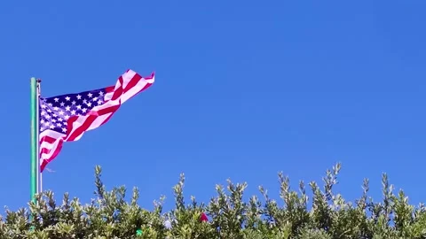 The American Flag Flutters in the Wind. Slow Motion of the Flag. Stock Footage 220359290