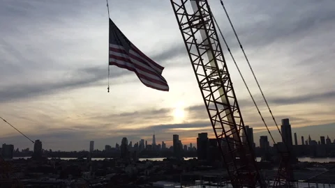 American Flag Flying from construction Crane Stock Footage 252784284