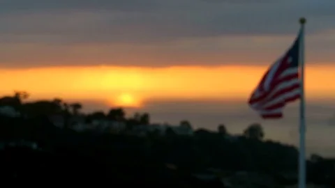 The American flag flying Stock Footage 75654833