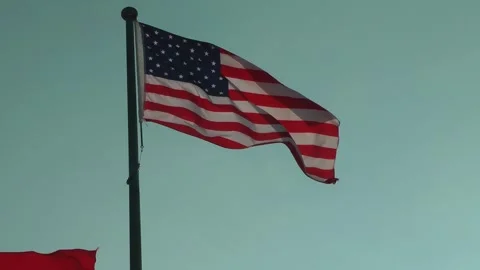 An American flag is flying 動画素材 343389944