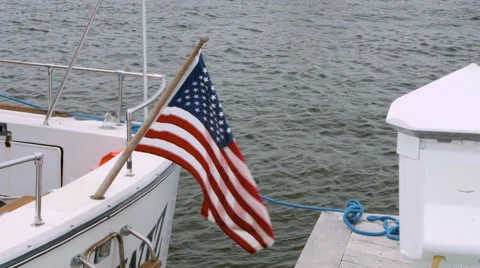 American Flag flying free on the back of a boat in Long Island New York Stock Footage 64921439
