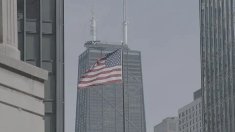 American Flag Flying In Front Of Chicago Skyline Stock Footage 135084804