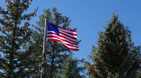 American Flag flying high on the mountaintop, 4K Stock Footage 56432060