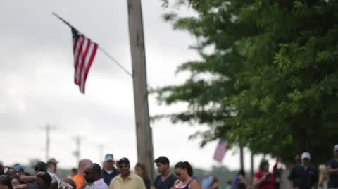 American Flag Flying Over Crowd 動画素材 26113643