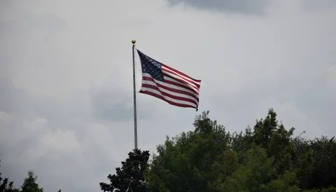 American flag flying Stock Photos