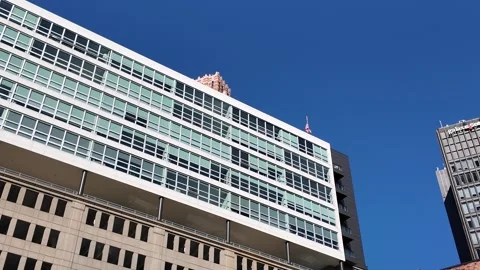 American Flag Flying on a Tall Building in Downtown Detroit Stock Footage 342865597