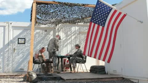 American flag flying at US base in middle east (HD) c Stock Footage 11439307