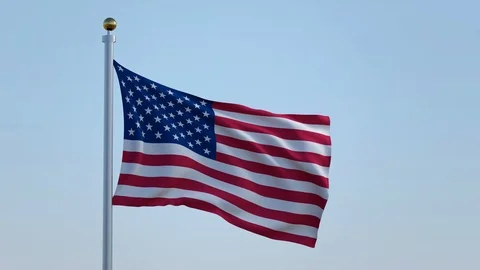 American flag in front of a blue sky Stock Footage 89049735