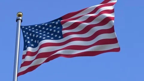 American Flag in front of a blue sky Stock Footage 89052129