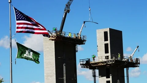 American flag in front of construction tower Stock Footage 73777286