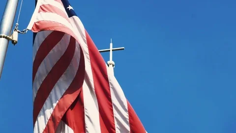 American Flag in front of cross steeple. Vídeo Stock 73149715