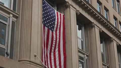 American Flag Hanging On Classical Building Facade DC Stock Footage 309022561