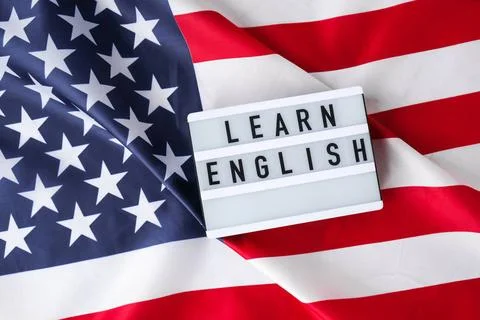American flag. Lightbox with text LEARN ENGLISH Flag of the united states ... Fotos Stock