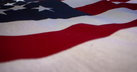 American Flag Macro Flyover Blue Background Stock Footage