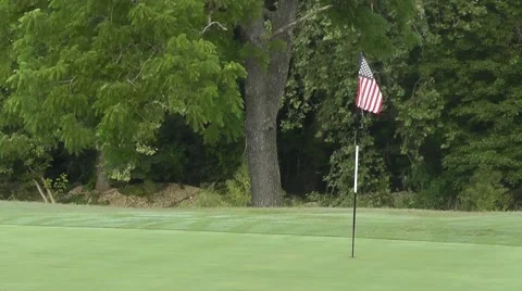 American Flag Marks the Hole on the Golf Course Green - All American Golf 스톡 동영상 53012918