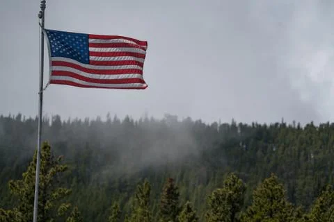 American Flag in the Mountains Stock Photos