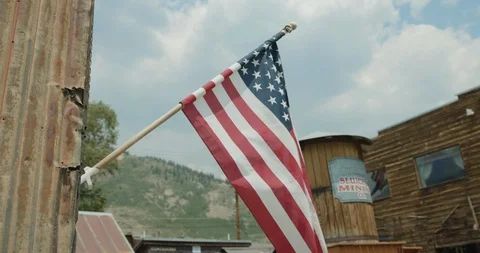American flag in old mining town Stock Footage 92855447