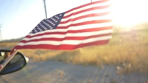 American Flag out of Car Window Stock Footage 79183507