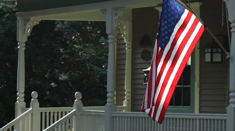 American Flag outside house in a small town, morning Stock Footage 41159953