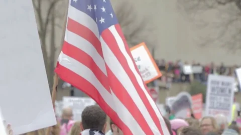 American Flag Over Protestor Crowd - Womens March Stock Footage 81252879