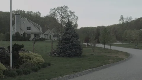 American Flag Pan Up In Front of Suburban Nighborhood Stock Footage 90356548