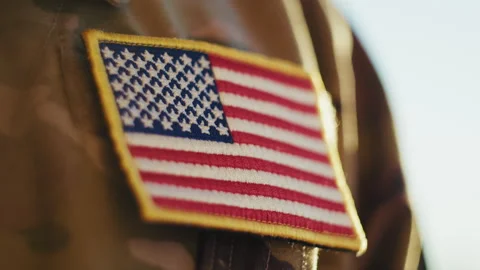 American Flag Patch on a Soldier Chest During Veterans Day Celebration 스톡 동영상 322173132