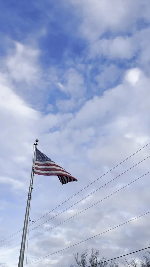 American Flag Pole Against Blue Cloudy Sky Видео 344991180