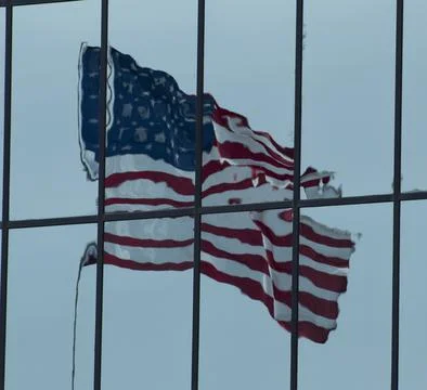 American Flag reflection in a window Stock Photos