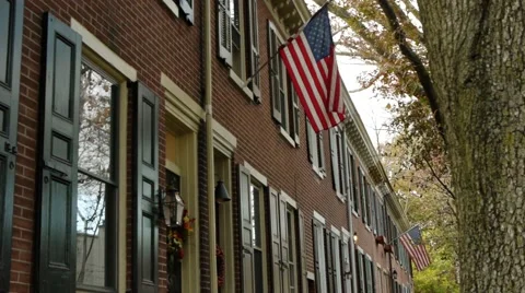American flag on a row home 2 of 3 Stock Footage 48332164