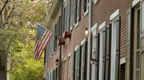 American flag on a row home 3 of 3 Stock Footage 48332260