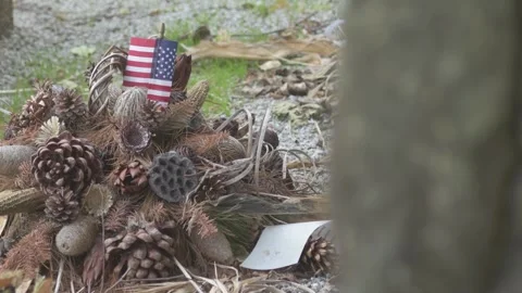 American Flag Sitting in Front of War Memorial Stock Footage 325263092