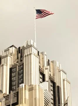 American flag on skyscraper Stock Photos