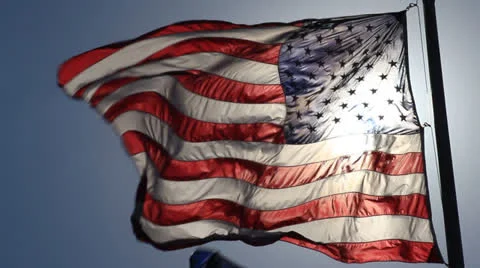 AMERICAN FLAG WITH SUN BEHIND IT Stock Footage 26095290