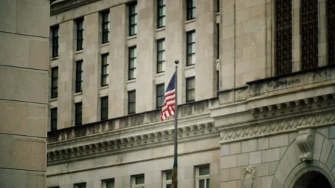 American flag super slow motion waves in wind against stone government buildings Stock Footage 106340116