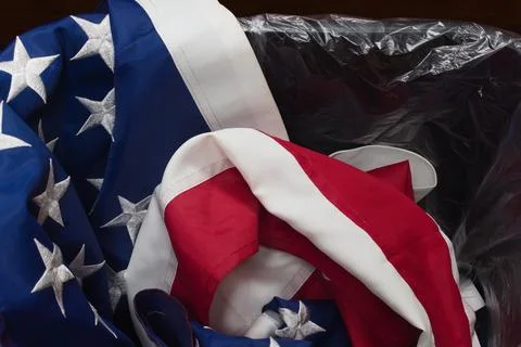 An American flag in the Trash Stock Photos