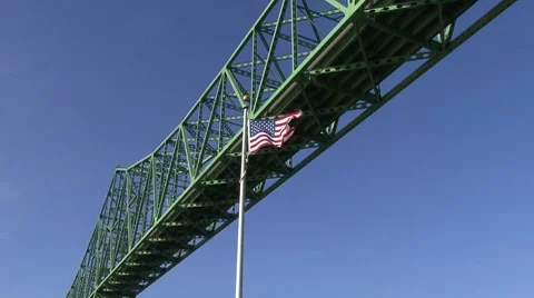 The American Flag under a bridge Stock Footage 8678655