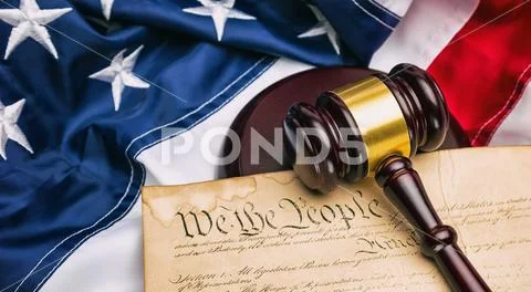 American flag with US constitution and a judge's gavel symbolizing the Americ Stock Photos