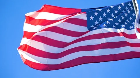 American Flag US Flag Slow Motion Blue Sky Stock Footage 100272652