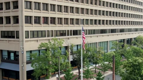American flag at US government building, courthouse, business office, Stock Footage