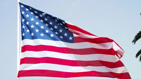 American flag wave in the wind on flagpole against the sky. close-up of USA flag Stock-Footage 210856977