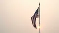 American Flag Waves in Slow Wind and Smoke as Burning Wildfires Rage in the West 4k or 4k+ Resolution