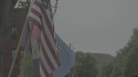 An American Flag Waves in a Small Town in Montana Stock Footage 235212788